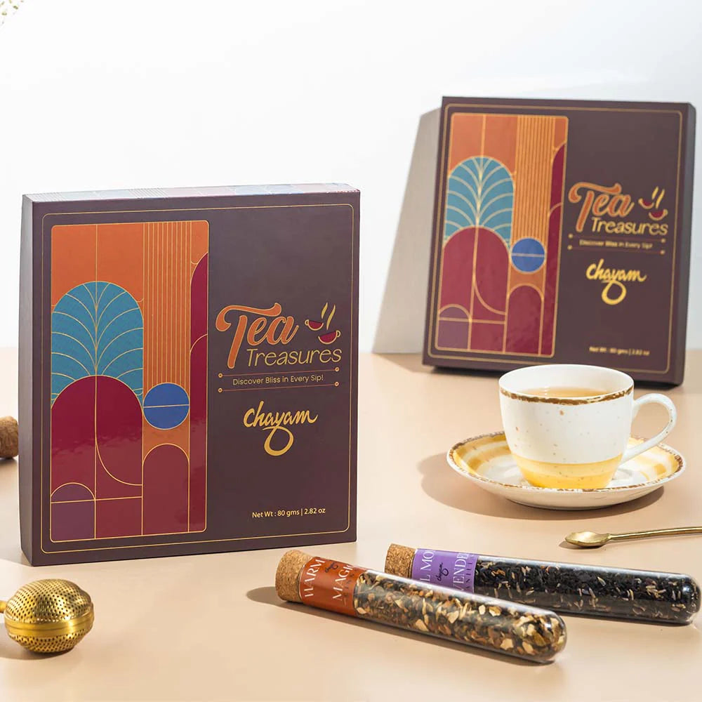 Tea Treasures Chayam tea packaging with a cup of tea on a saucer.