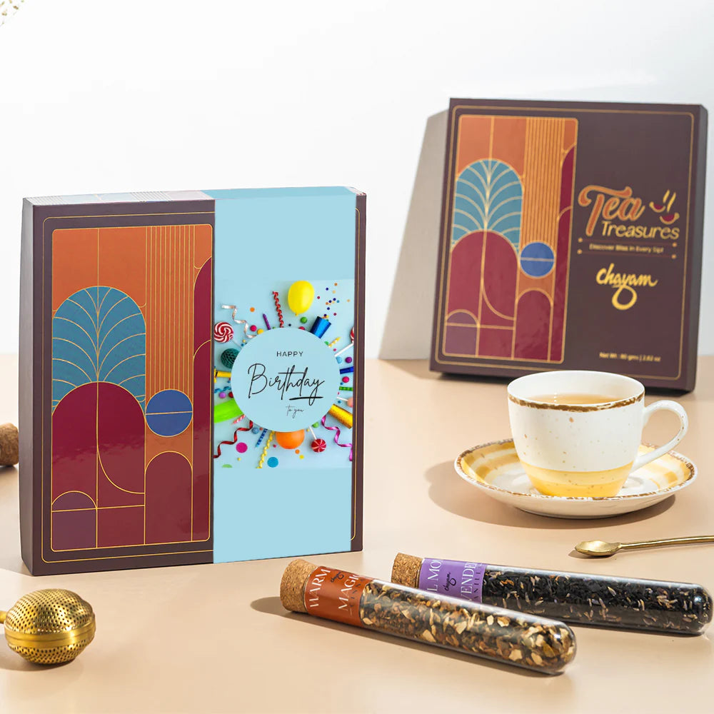 Chayam Tea Treasures packaging with a birthday card and tea cups on a table for birthday gift