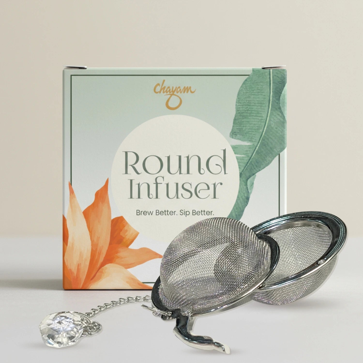 Round tea infuser with packaging on a light background